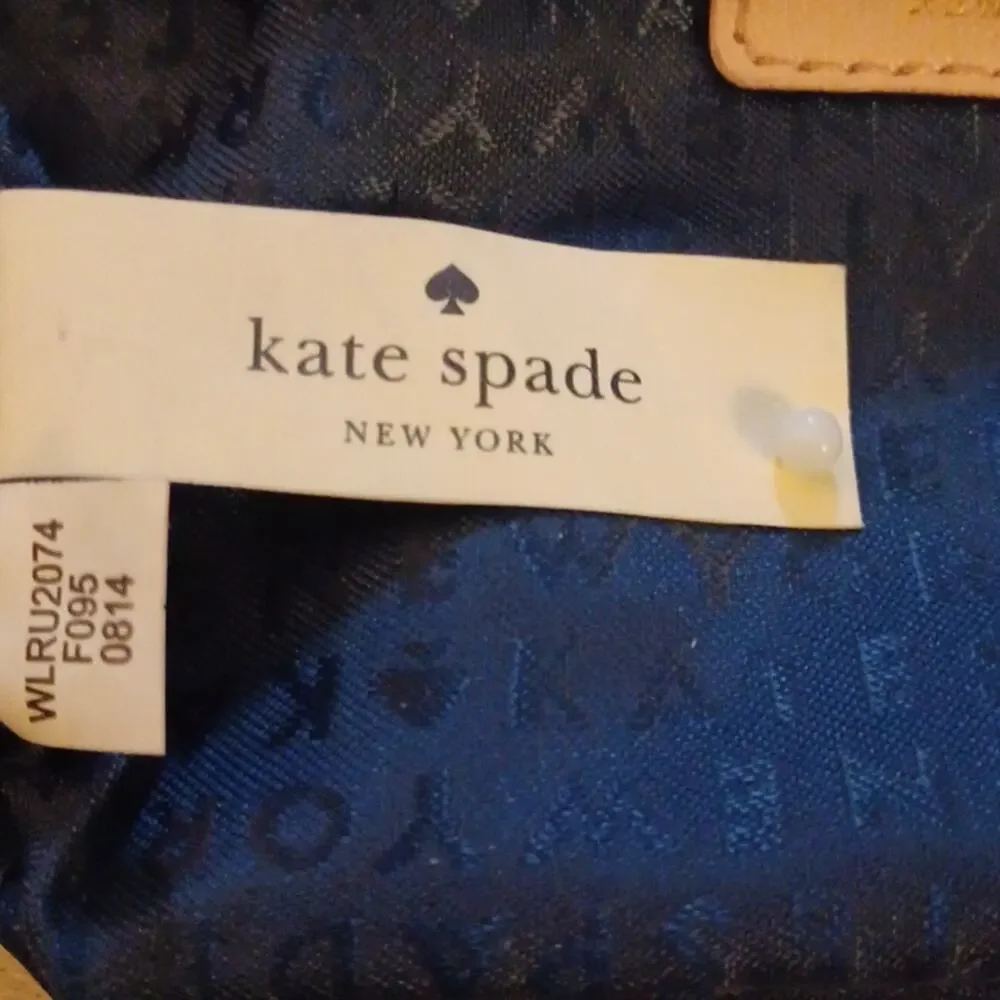 Kate Spade New York Pink Tone Wristlet.